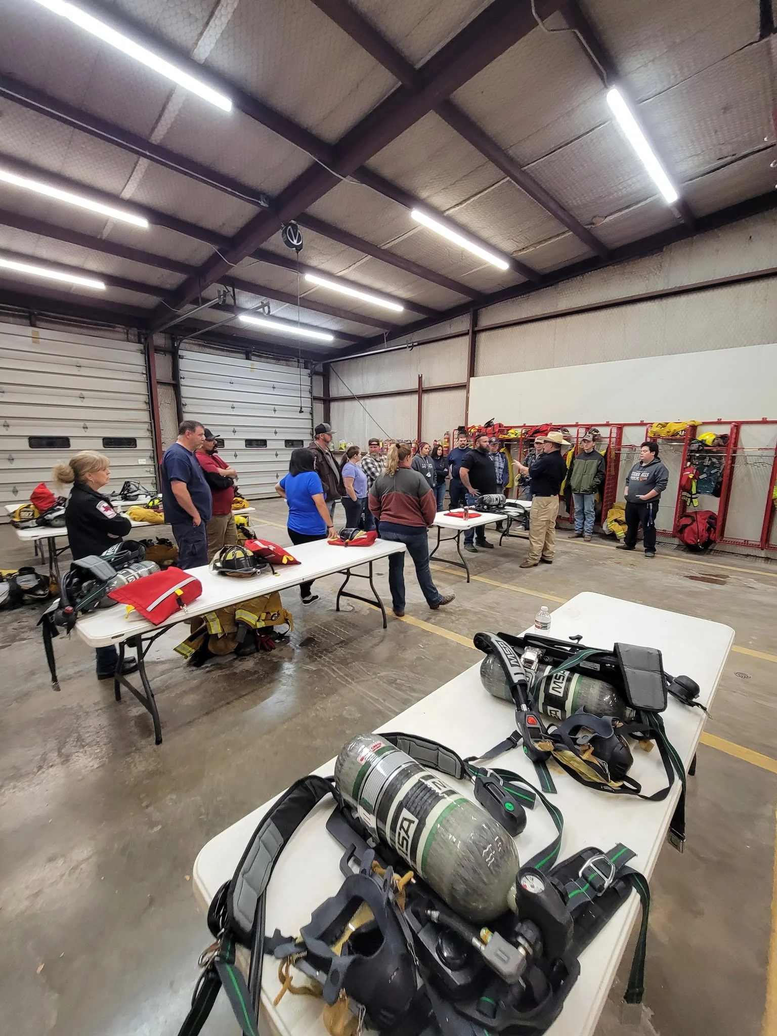 Grape Creek VFD members learning together at the station with firefighting equipment